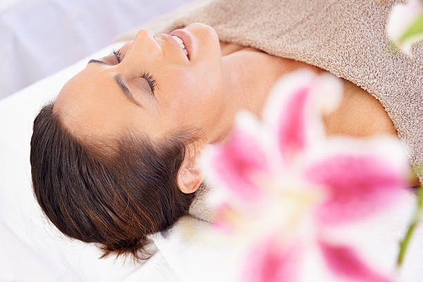 Relaxed woman enjoying a rejuvenating spa session.